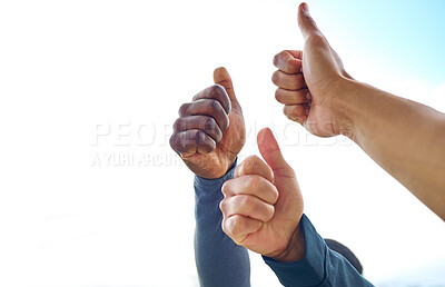 Buy stock photo Closeup shot of a group of unrecognisable people showing thumbs up while exercising outdoors