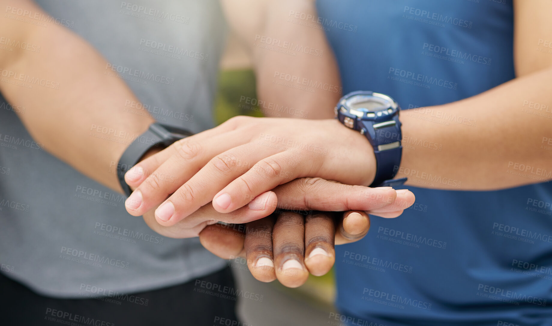 Buy stock photo Closeup shot of two unrecognisable men joining their hands together in a huddle