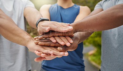 Buy stock photo Closeup shot of a group of unrecognisable men joining their hands together in a huddle