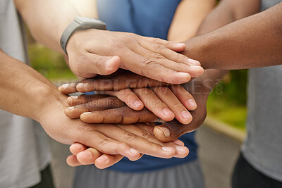 Buy stock photo Closeup shot of a group of unrecognisable men joining their hands together in a huddle