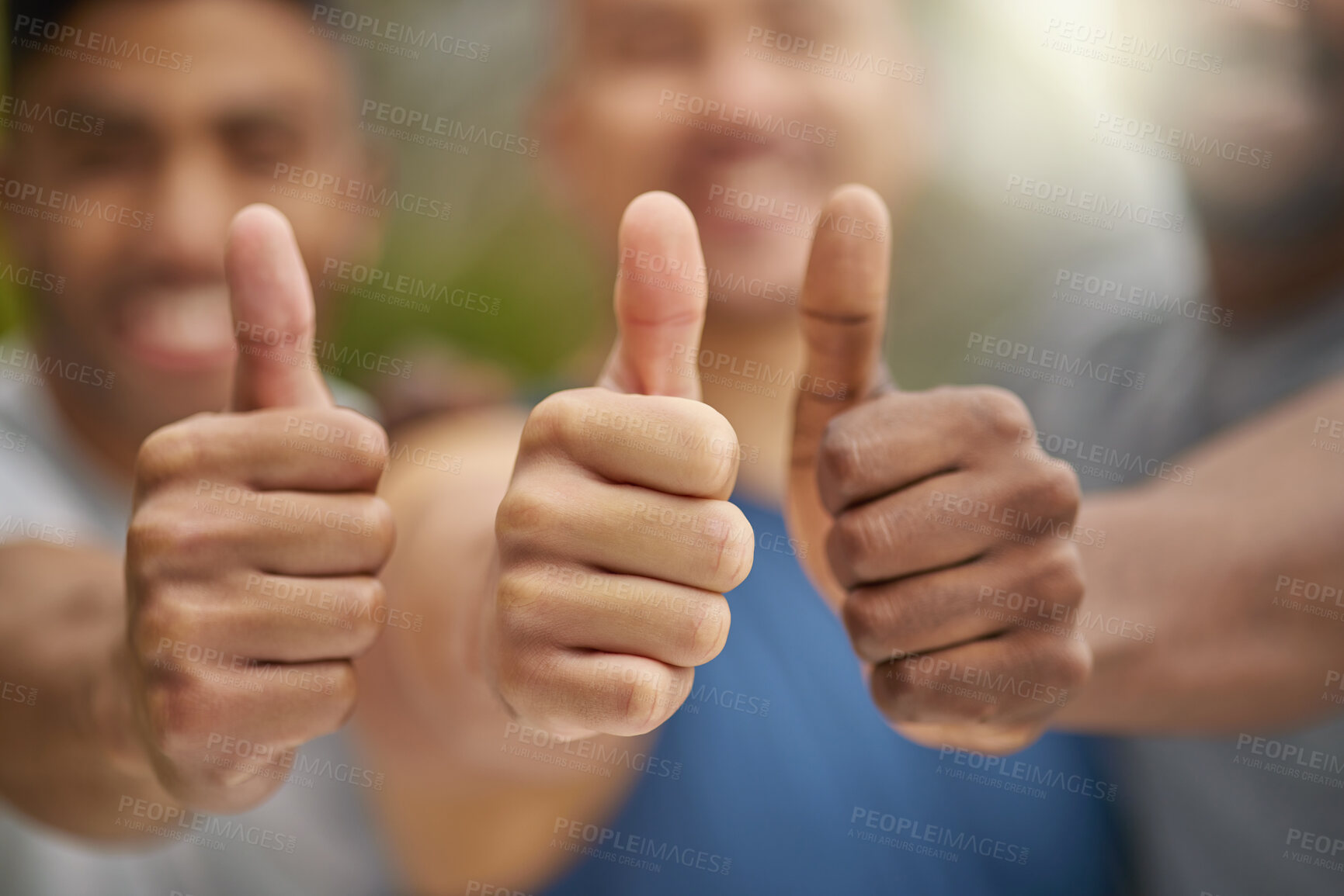 Buy stock photo Closeup shot of a group of unrecognisable men showing thumbs up while exercising outdoors