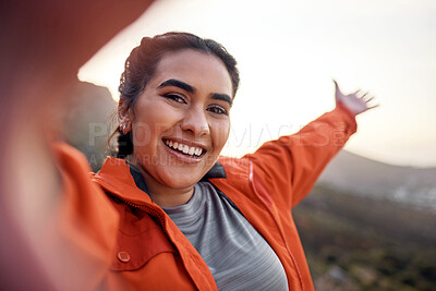 Buy stock photo Cropped portrait of an attractive young woman taking selfies while hiking in the mountains