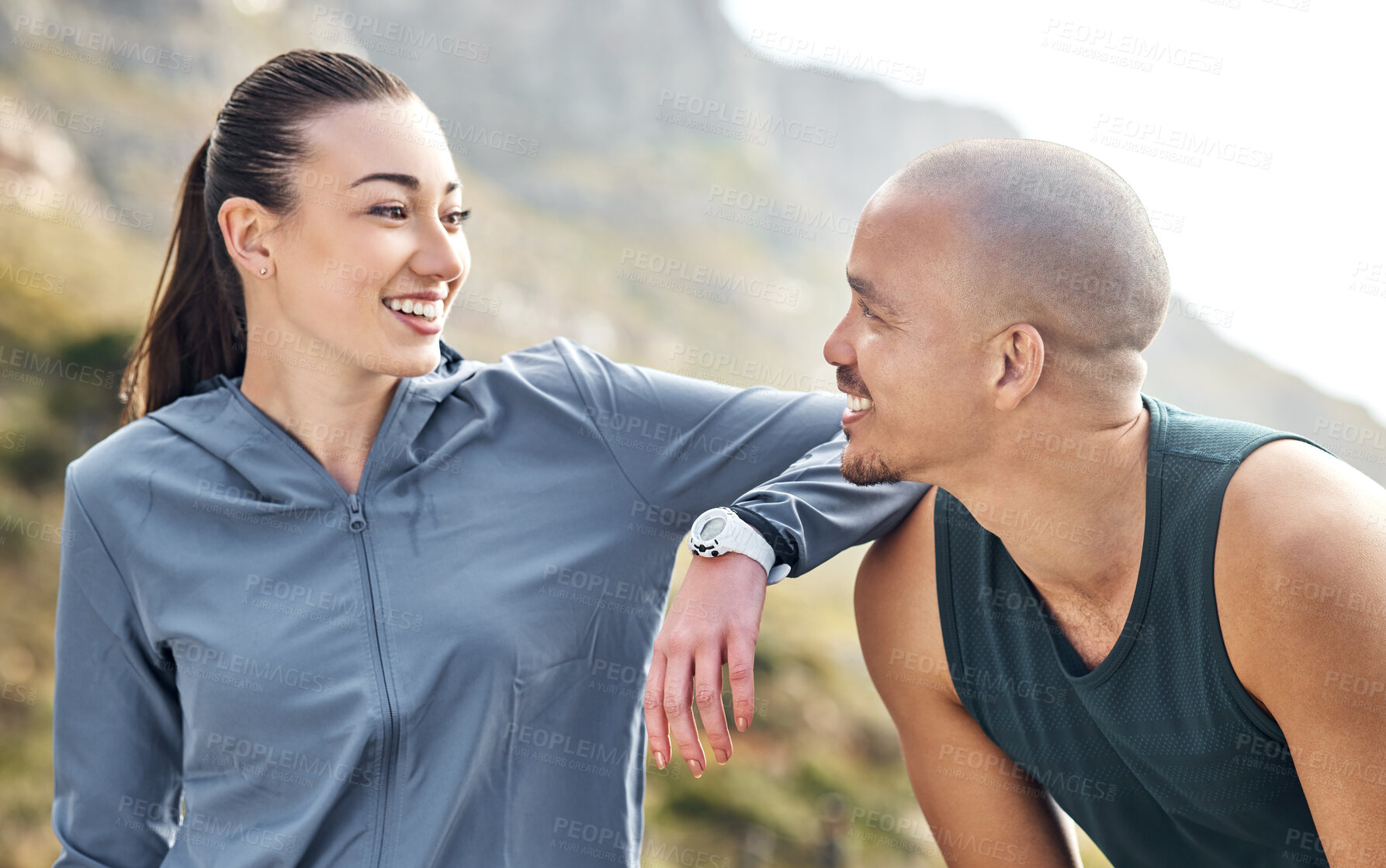 Buy stock photo Shot of a couple out for a run on a mountain road