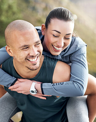 Buy stock photo Shot of a man carrying his girlfriend on his back while out for a workout