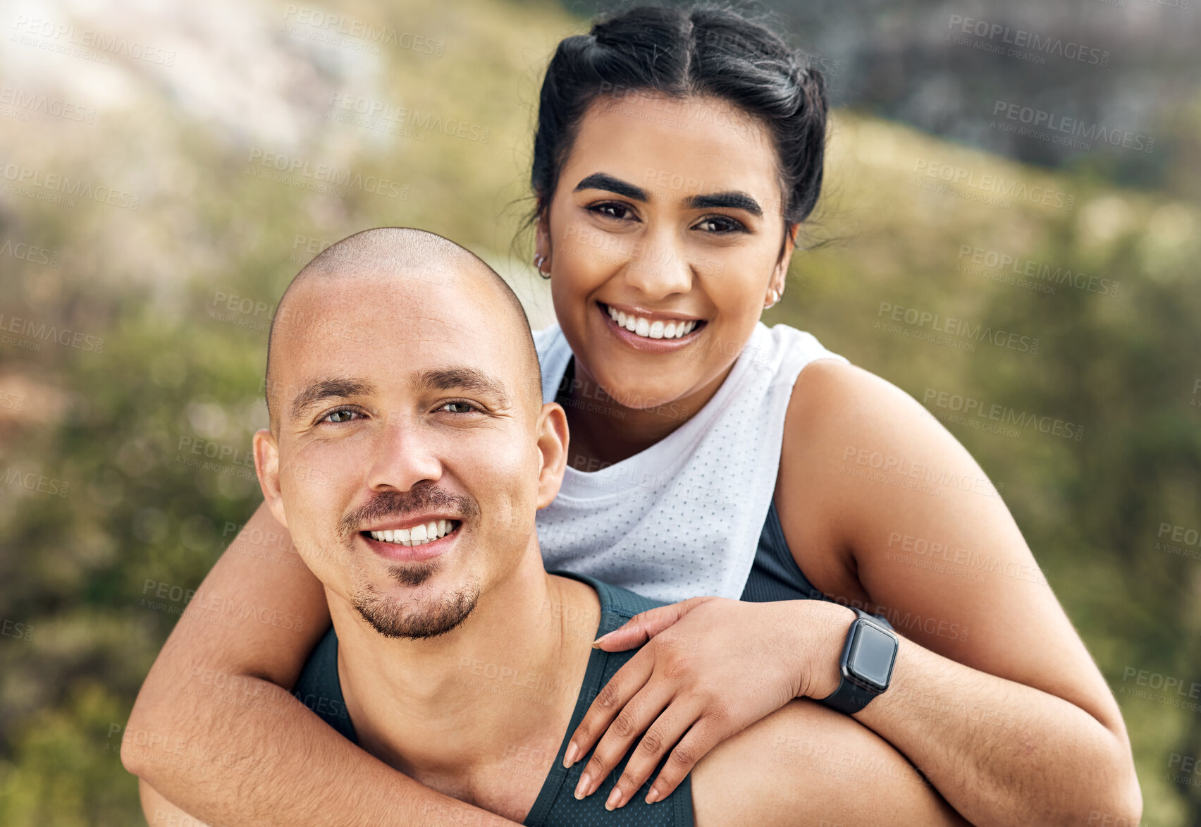 Buy stock photo Shot of a man carrying his girlfriend on his back while out for a workout