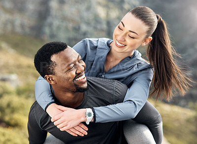 Buy stock photo Shot of a man carrying his girlfriend on his back while out for a workout