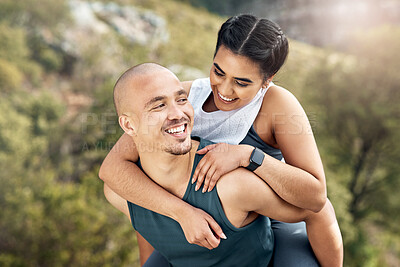 Buy stock photo Shot of a man carrying his girlfriend on his back while out for a workout