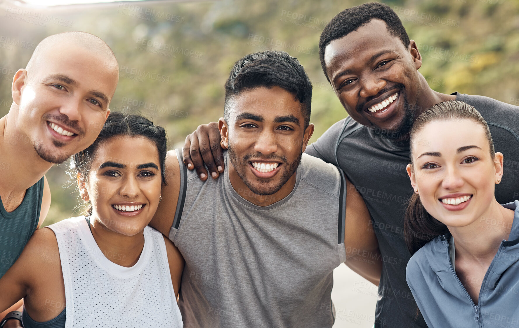 Buy stock photo Shot of a group of people out for a workout together on a mountain road