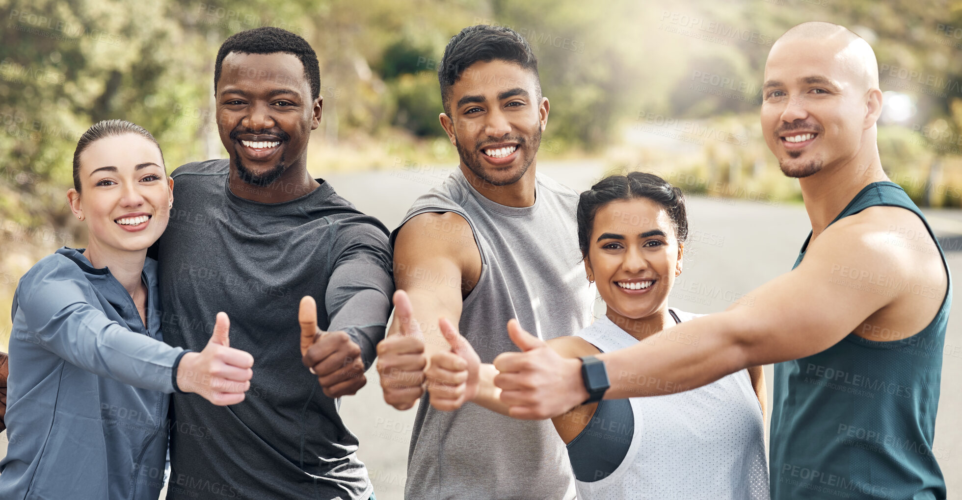 Buy stock photo Shot of a group of people out for a workout together on a mountain road