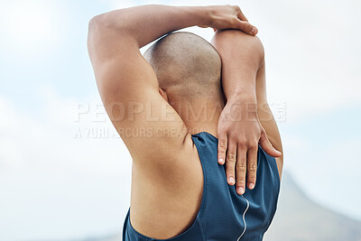 Buy stock photo Rearview shot of a man stretching outside