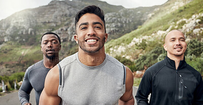 Buy stock photo Shot of three men out for a run on a mountain road