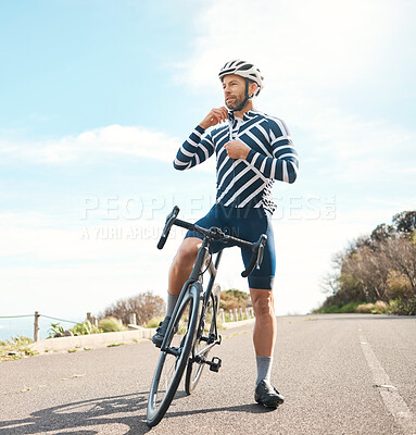 Buy stock photo Full length shot of a handsome mature man cycling outdoors