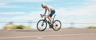 Buy stock photo Full length shot of a handsome mature man cycling outdoors