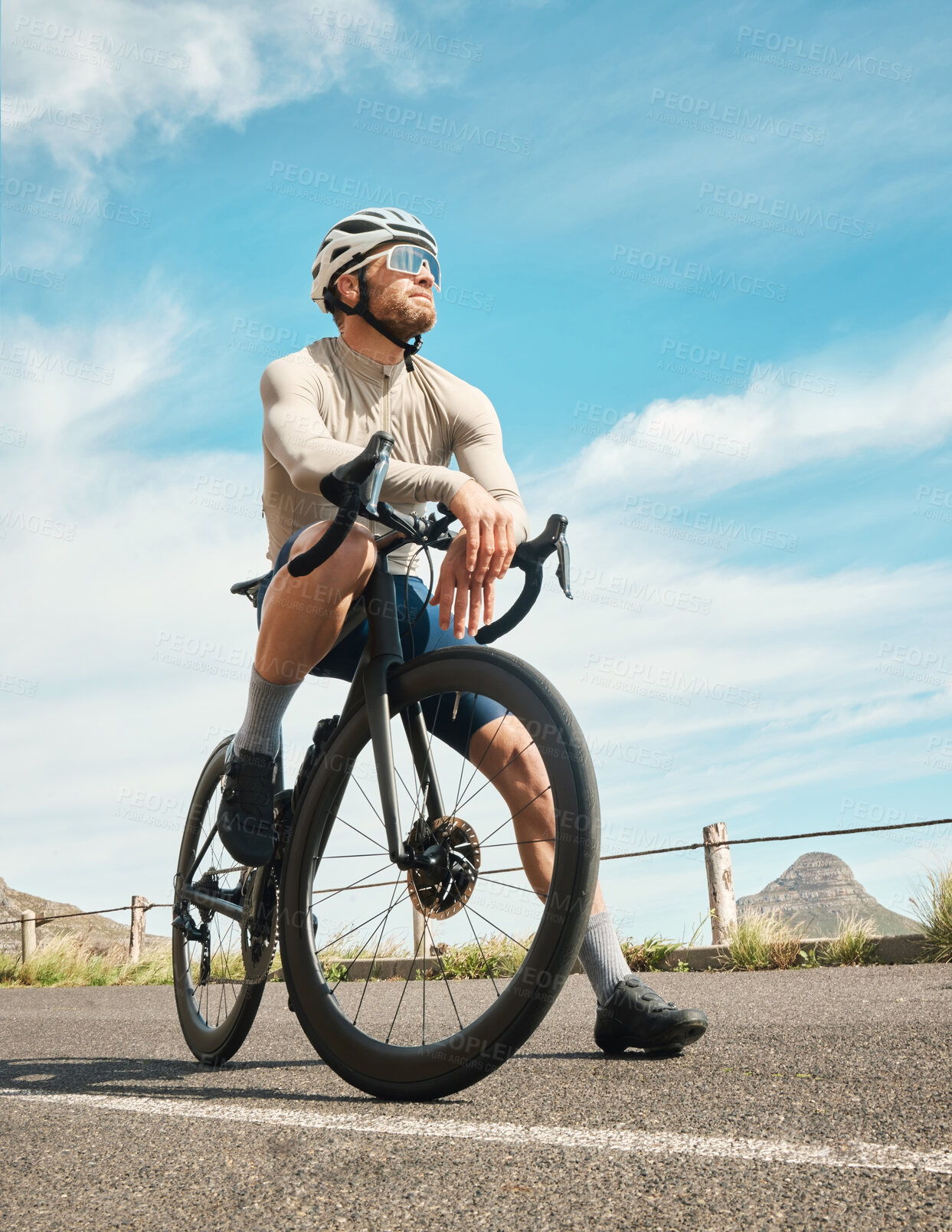 Buy stock photo Full length shot of a handsome mature man taking a break while cycling outdoors