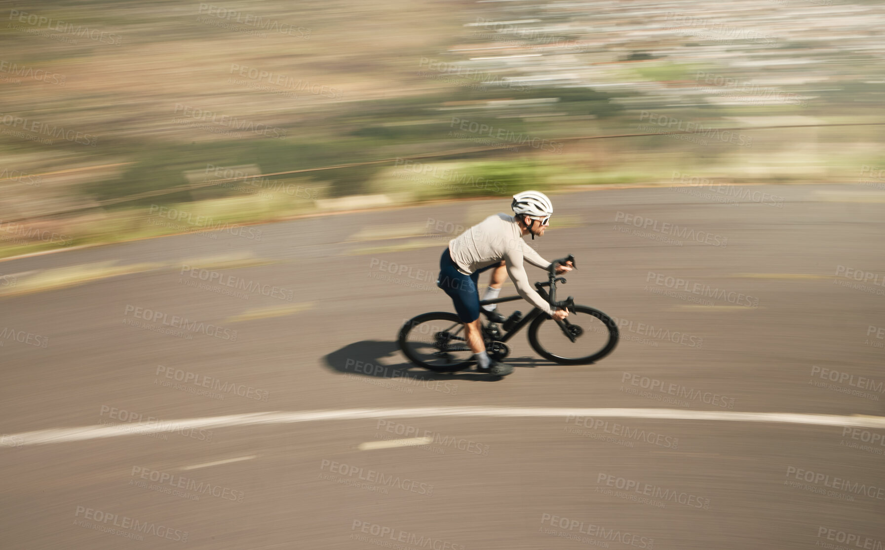 Buy stock photo High angle shot of a handsome mature man cycling outdoors