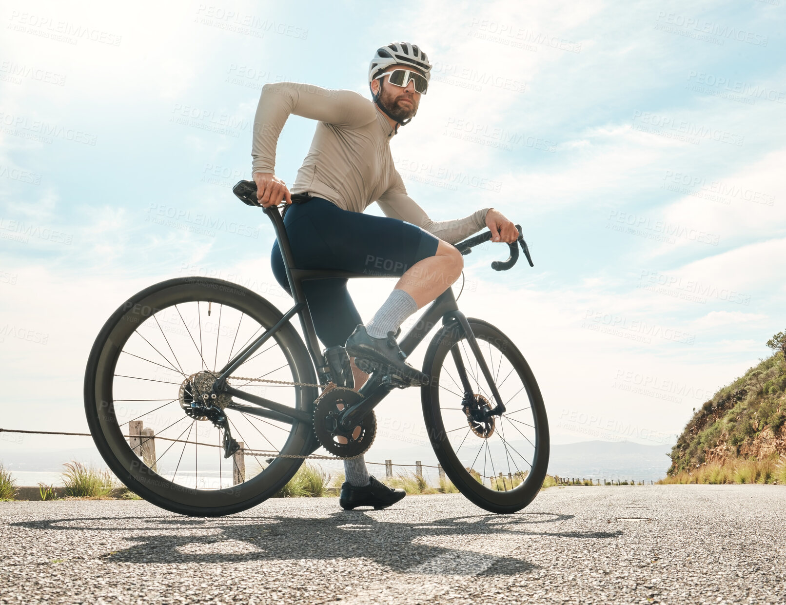 Buy stock photo Full length shot of a handsome mature man taking a break while cycling outdoors