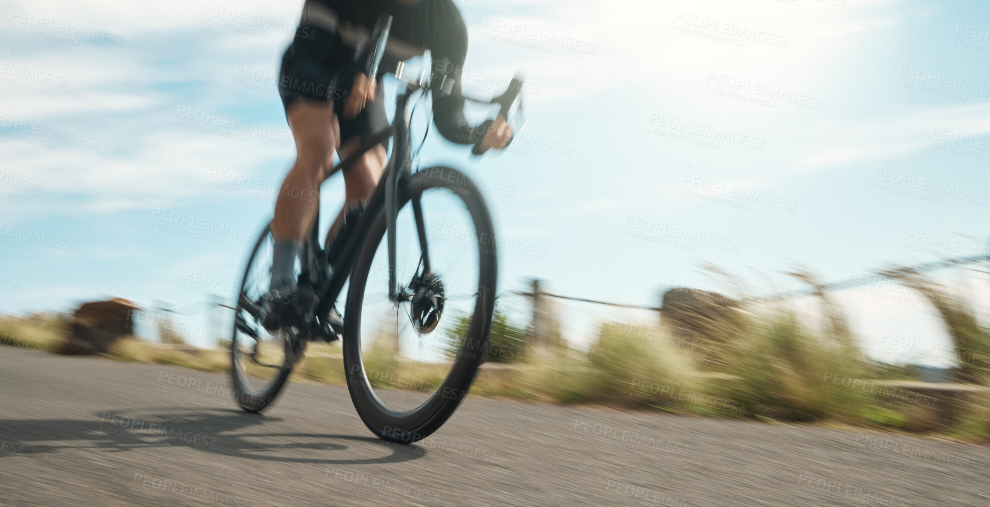 Buy stock photo Cropped shot of an unrecognizable man cycling outdoors