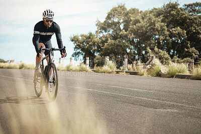 Buy stock photo Full length shot of a handsome mature man cycling outdoors