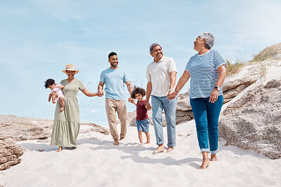 Buy stock photo Shot of a multi-generational family spending the day at the beach