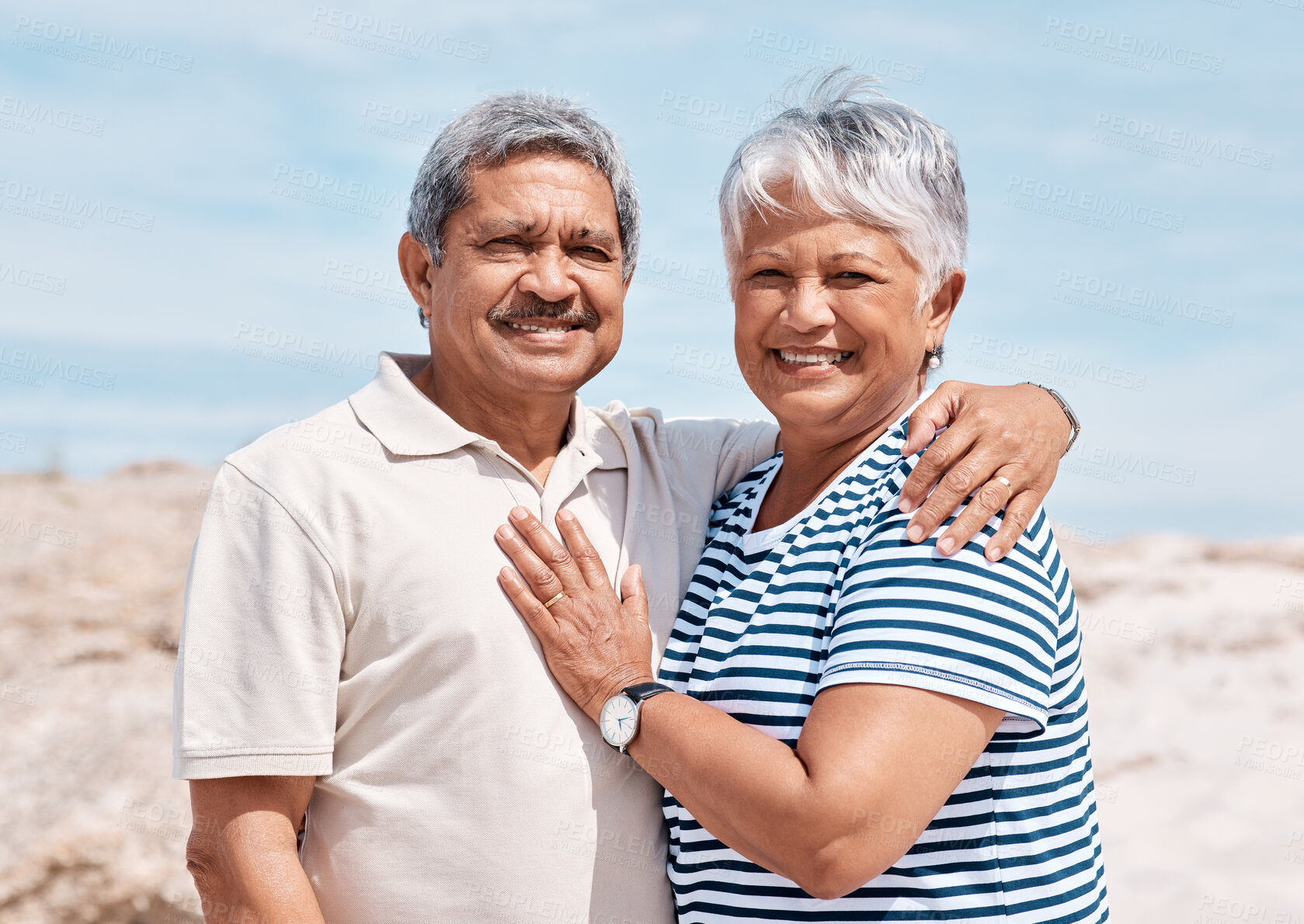 Buy stock photo Shot of a senior couple standing together on the beach