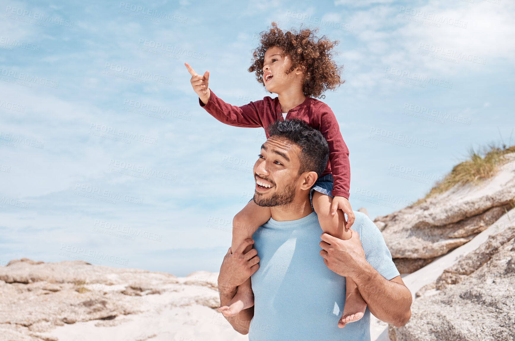 Buy stock photo Shot of a man spending time at the beach with his son