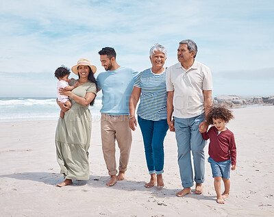 Buy stock photo Shot of a multi-generational family spending the day at the beach