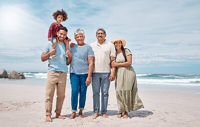 Buy stock photo Shot of a multi-generational family spending the day at the beach