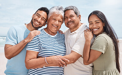 Buy stock photo Shot of a senior couple at the beach with their children