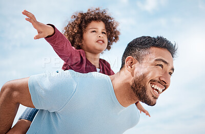 Buy stock photo Shot of a man spending time at the beach with his son