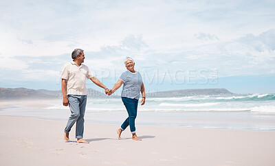 Buy stock photo Shot of a senior couple taking a walk on the beach