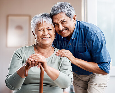 Buy stock photo Shot of a happy senior couple relaxing together at home