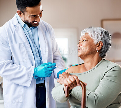 Buy stock photo Shot of a doctor giving an older woman an injection at home
