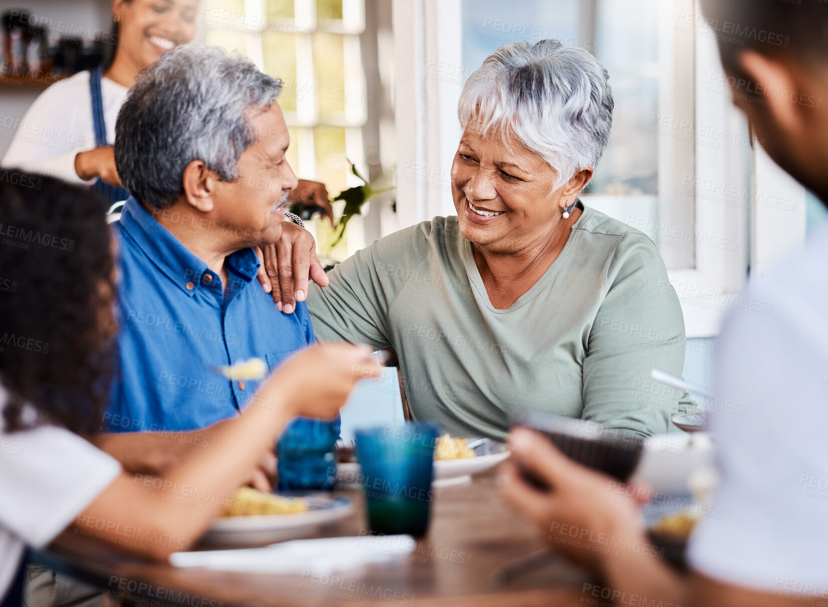 Buy stock photo Shot of a happy family having lunch together at home