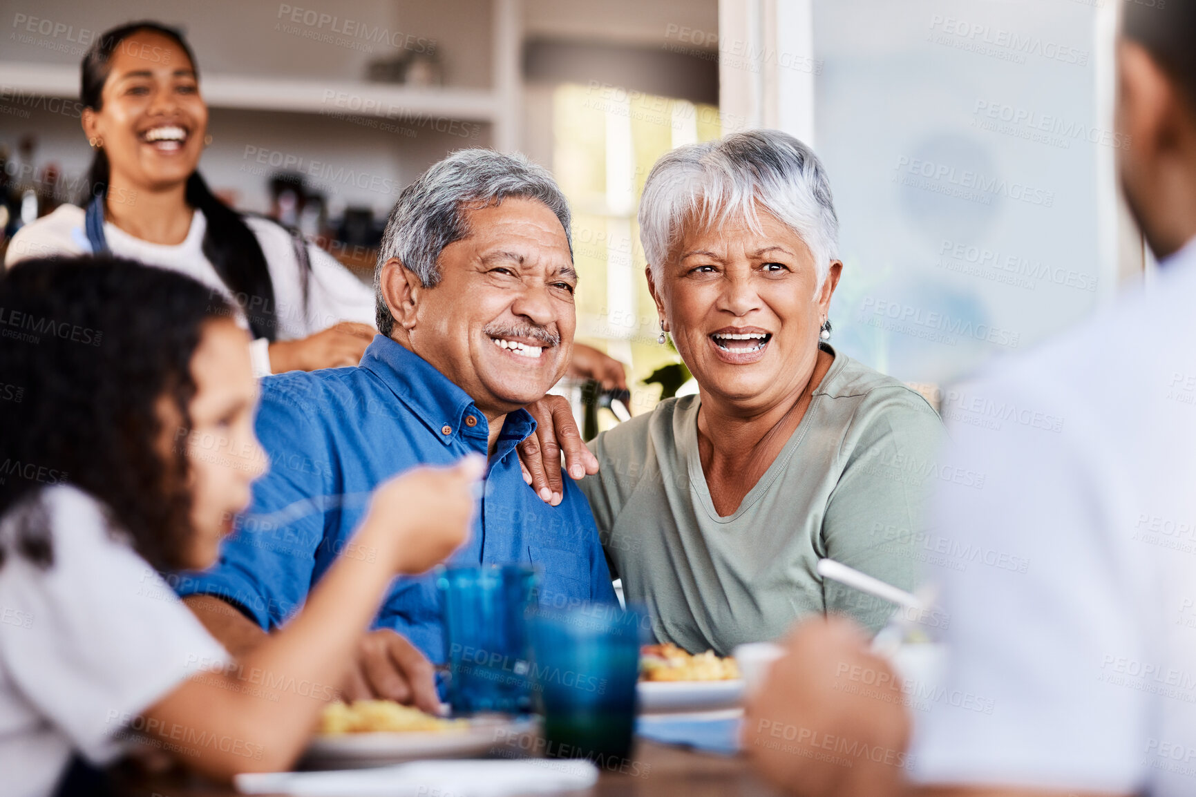 Buy stock photo Shot of a happy family having lunch together at home