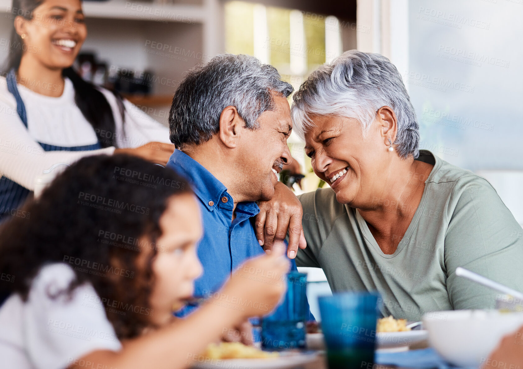 Buy stock photo Shot of a happy family having lunch together at home