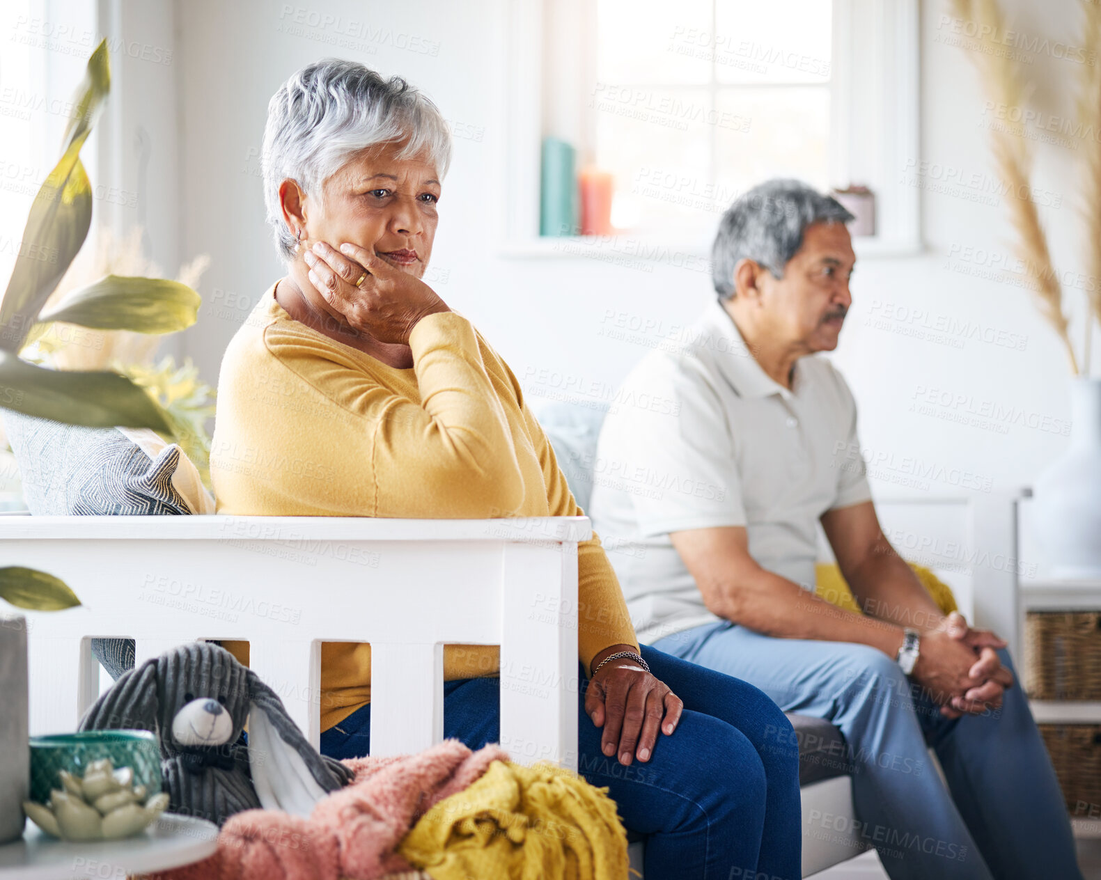 Buy stock photo Shot of a senior couple arguing at home