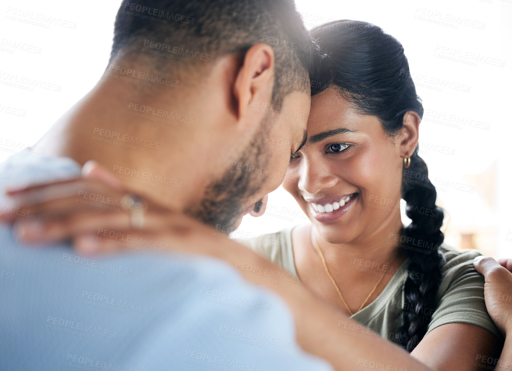 Buy stock photo Shot of a young couple spending time together at home