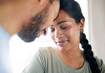 Buy stock photo Shot of a young couple spending time together at home