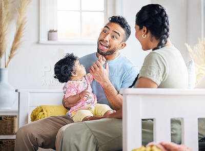 Buy stock photo Shot of a young family spending time together at home