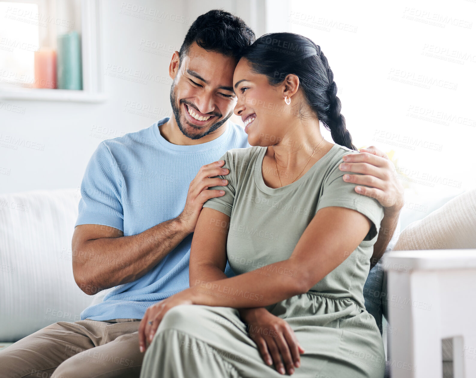 Buy stock photo Shot of a young couple spending time together at home