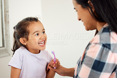 Buy stock photo Brushing teeth, dental and smile of mother and daughter in bathroom of home for hygiene together. Cleaning, love or teeth with single parent woman and girl child in apartment for morning routine