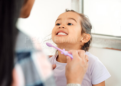 Buy stock photo Brushing teeth, love and smile of mother and daughter in bathroom of home for hygiene together. Cleaning, dental or teeth with single parent woman and girl child in apartment for morning routine