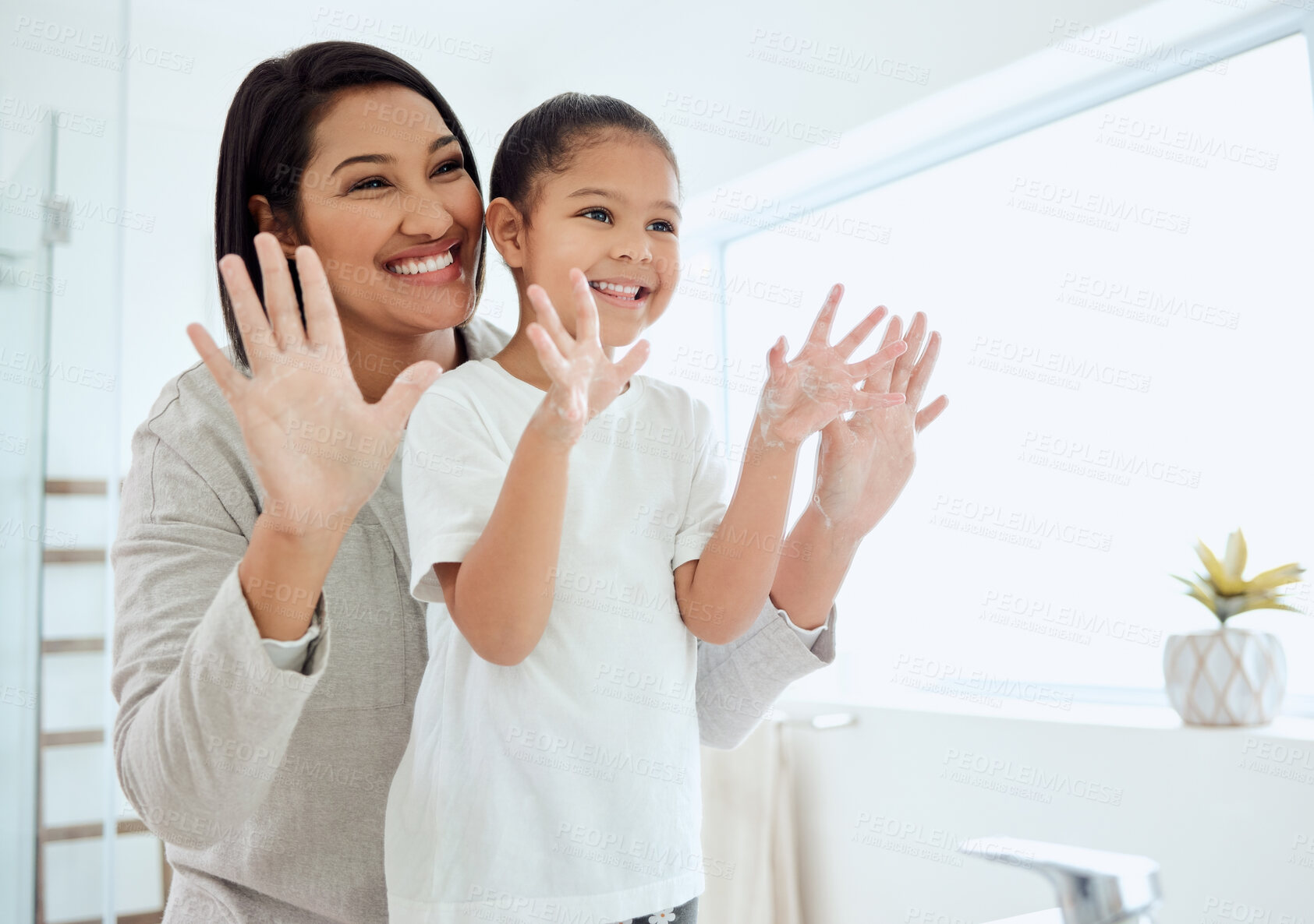 Buy stock photo Child, mother and washing hands with happy learning and soap in family home at morning. Cleaning, bathroom and young girl with germ protection and safety with help, love and health care from parent