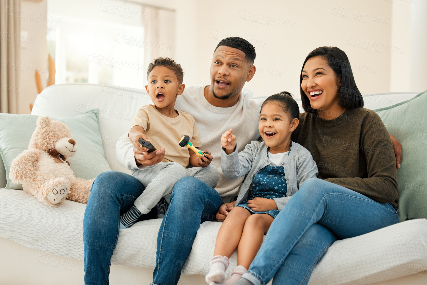 Buy stock photo Surprise, family and watching tv at house with streaming movie for love, care and bonding support in living room. Excited, parents and children and film show for wow, entertainment and subscription