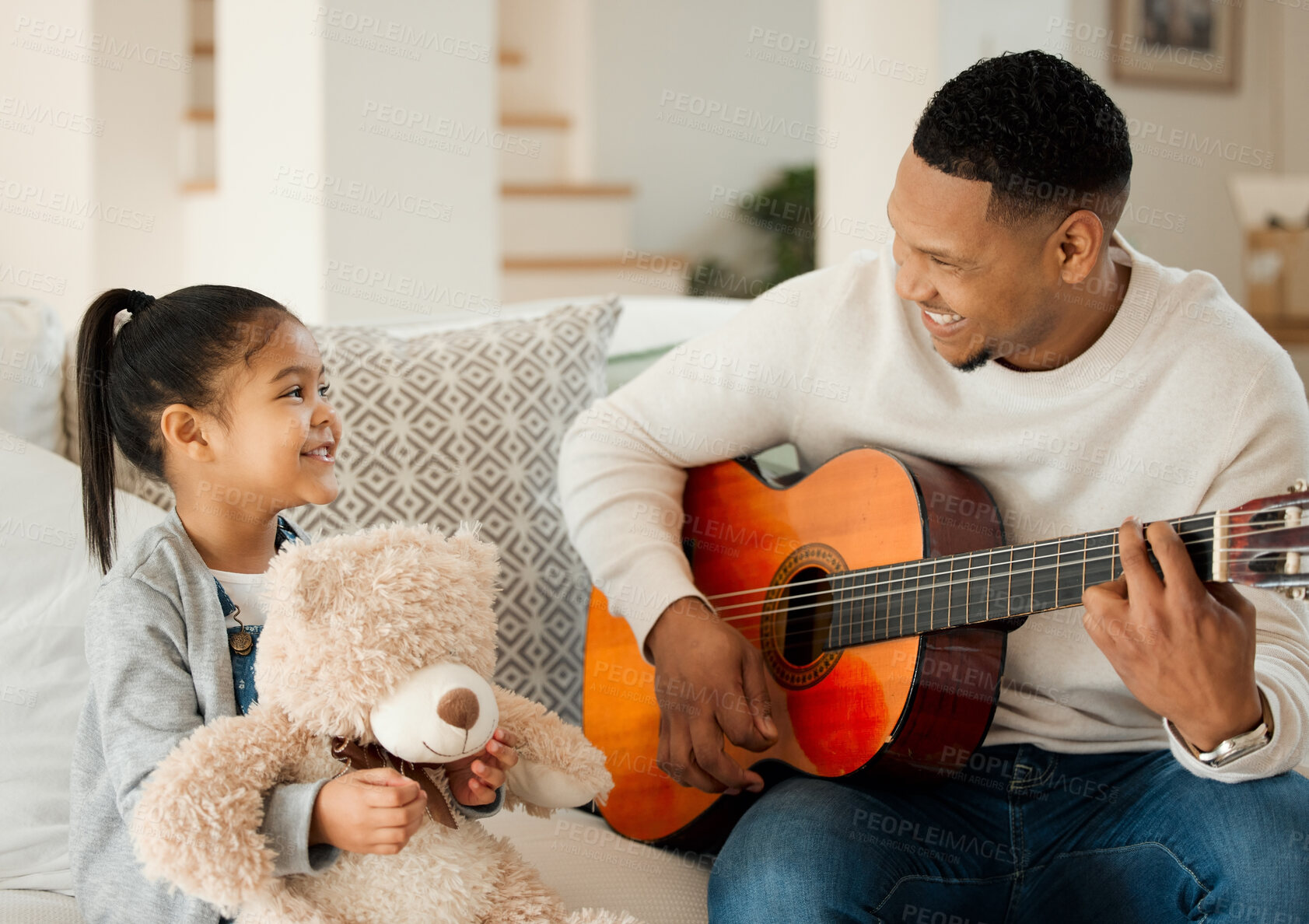 Buy stock photo Happy father, child and play guitar for learning, music and bonding with daughter in home. Dad, acoustic instrument or teaching girl for creative talent, art or jazz musician practice with teddy bear