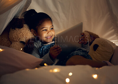 Buy stock photo House, night and girl with tablet, bedroom and relax with internet, connection and smile. Apartment, bedtime and happy kid with technology, evening and childhood with app for ebook, dark and story