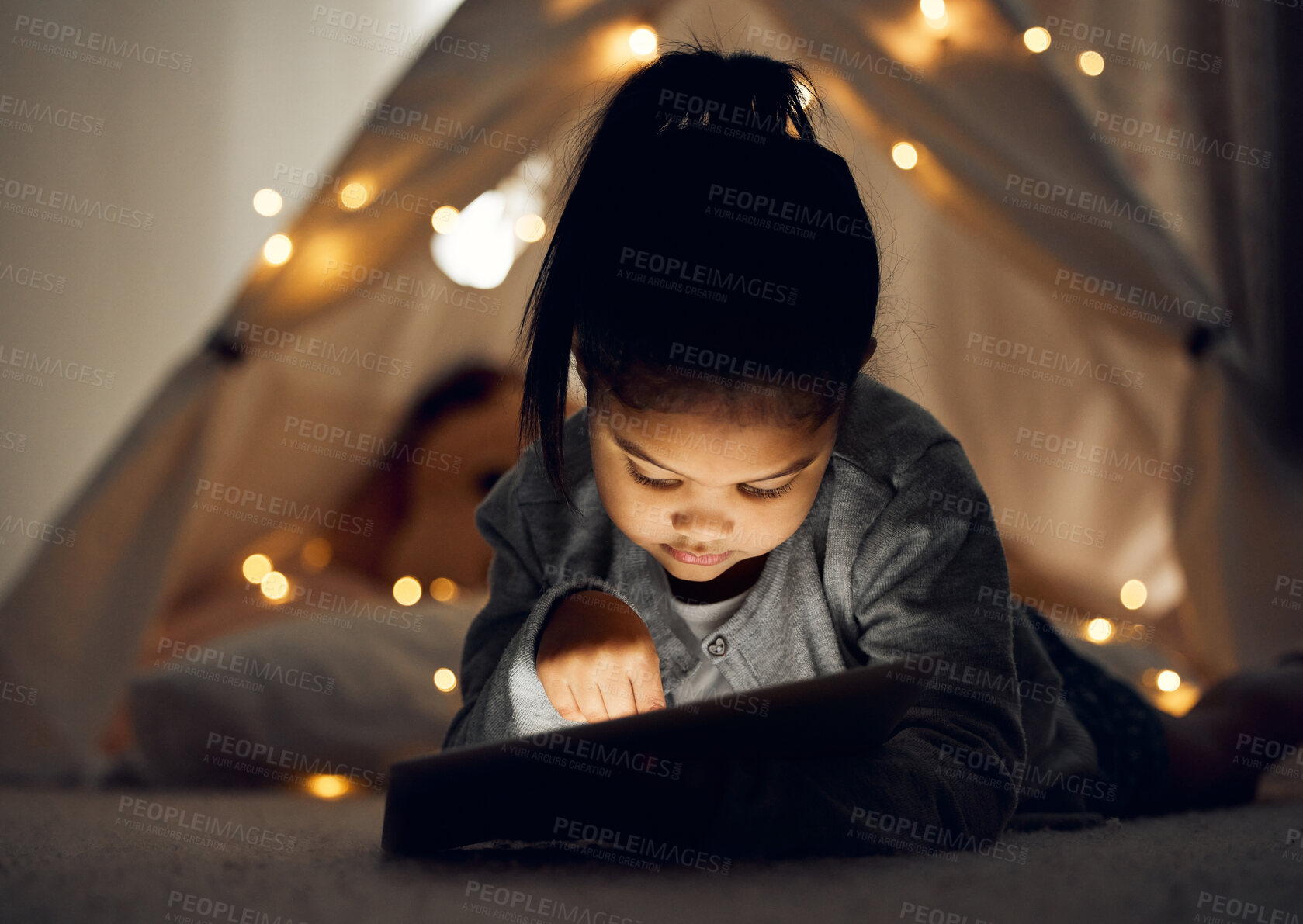 Buy stock photo Press, night and girl with tablet, bedroom and relax with internet, connection and clicking. Apartment, bedtime and happy kid with technology, evening and childhood with digital app, home and ebook