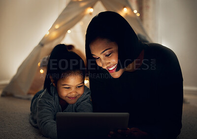 Buy stock photo Mother, happy girl and tablet at night in home, streaming series and online for movie subscription. Mom, daughter and watching comedy animation on floor of lounge, relax and game for bonding together