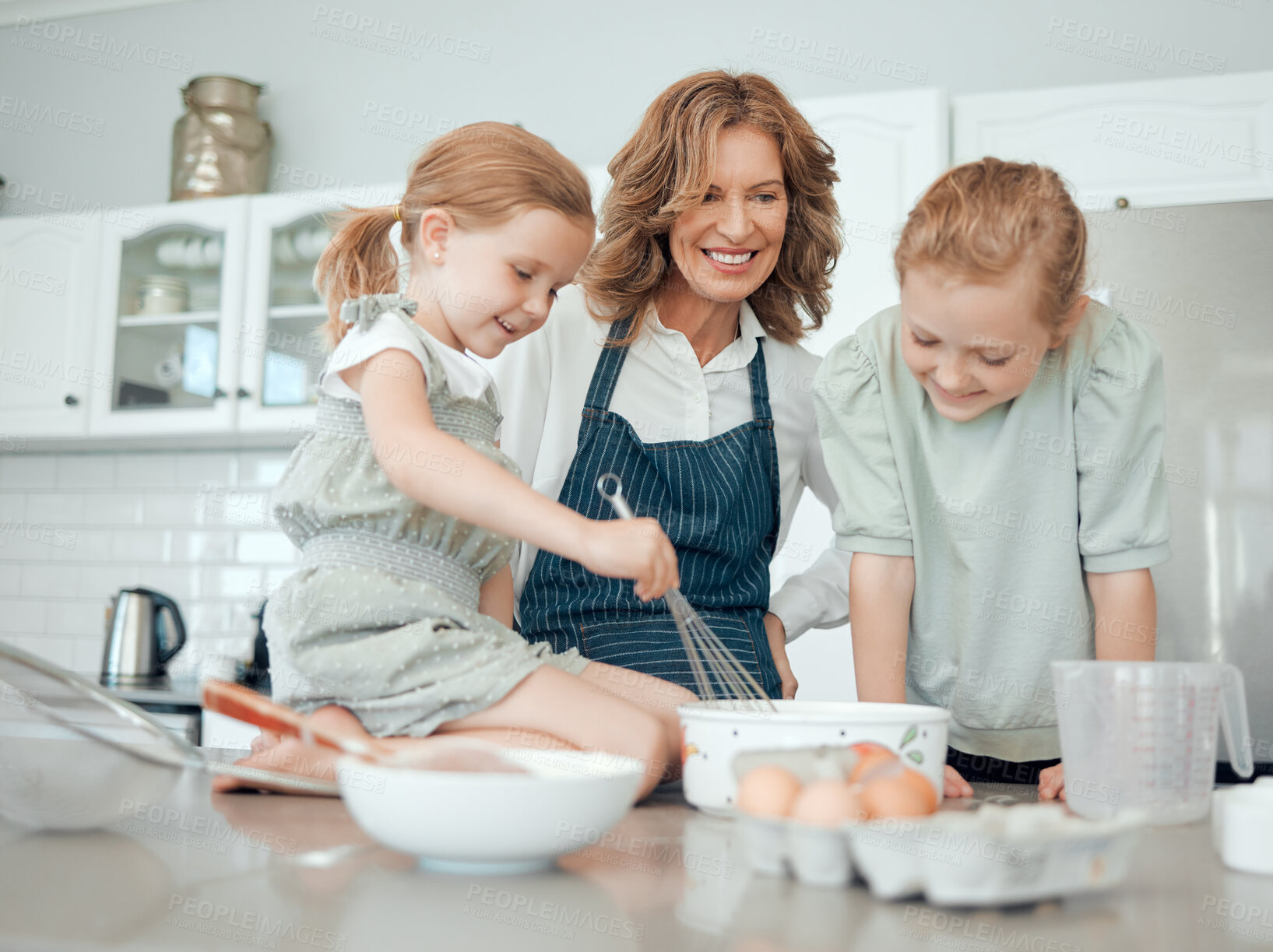 Buy stock photo Grandmother, help and children with learning, kitchen and home or house for pastry or dessert cake mixing ingredients. Happy, family and teaching cooking kids baking pudding, cookies or bakery recipe