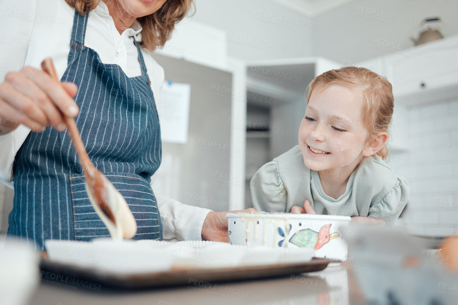 Buy stock photo Closeup, hand and girl baker for happy learning in kitchen, house or home for pastry or mixing cake dessert. Grandmother, bonding and cooking child teaching baking pudding, cupcakes or bakery recipe